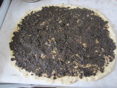 Spread paste of black olive and pickled jalapeno. Also sprinkle crush chilies and oregano